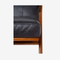 Angular teak wood frame craftsmanship close up loveseat detail